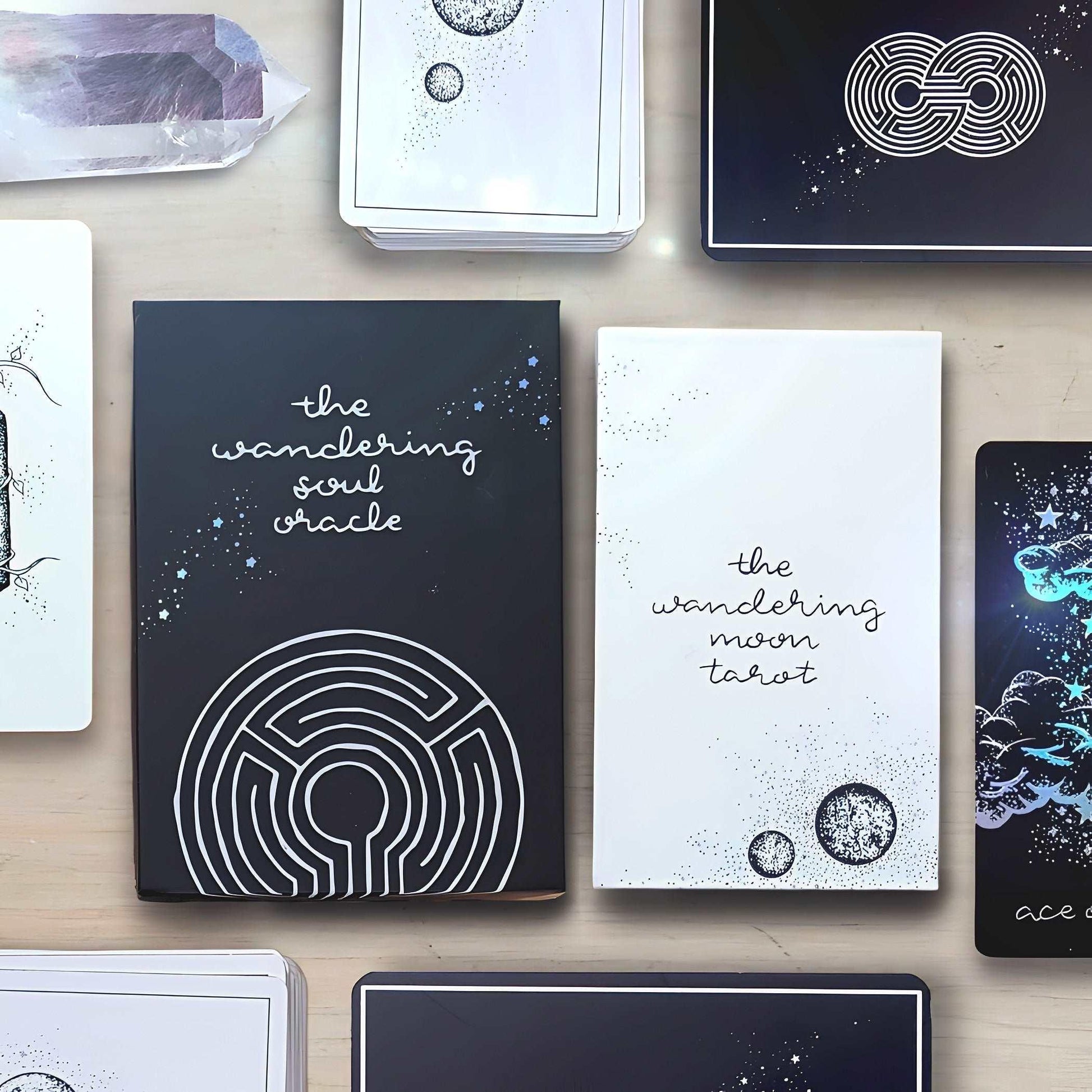 the two piece boxes from midnight sky and wandering soul oracle side by side, inverted tones.