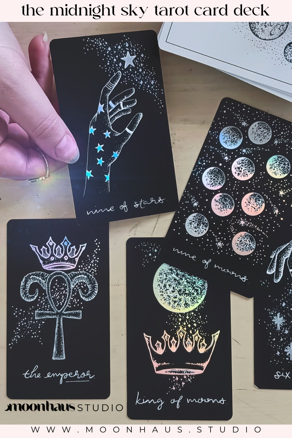 tarot cards, aesthetic: black tarot card art with holographic details & guidebook