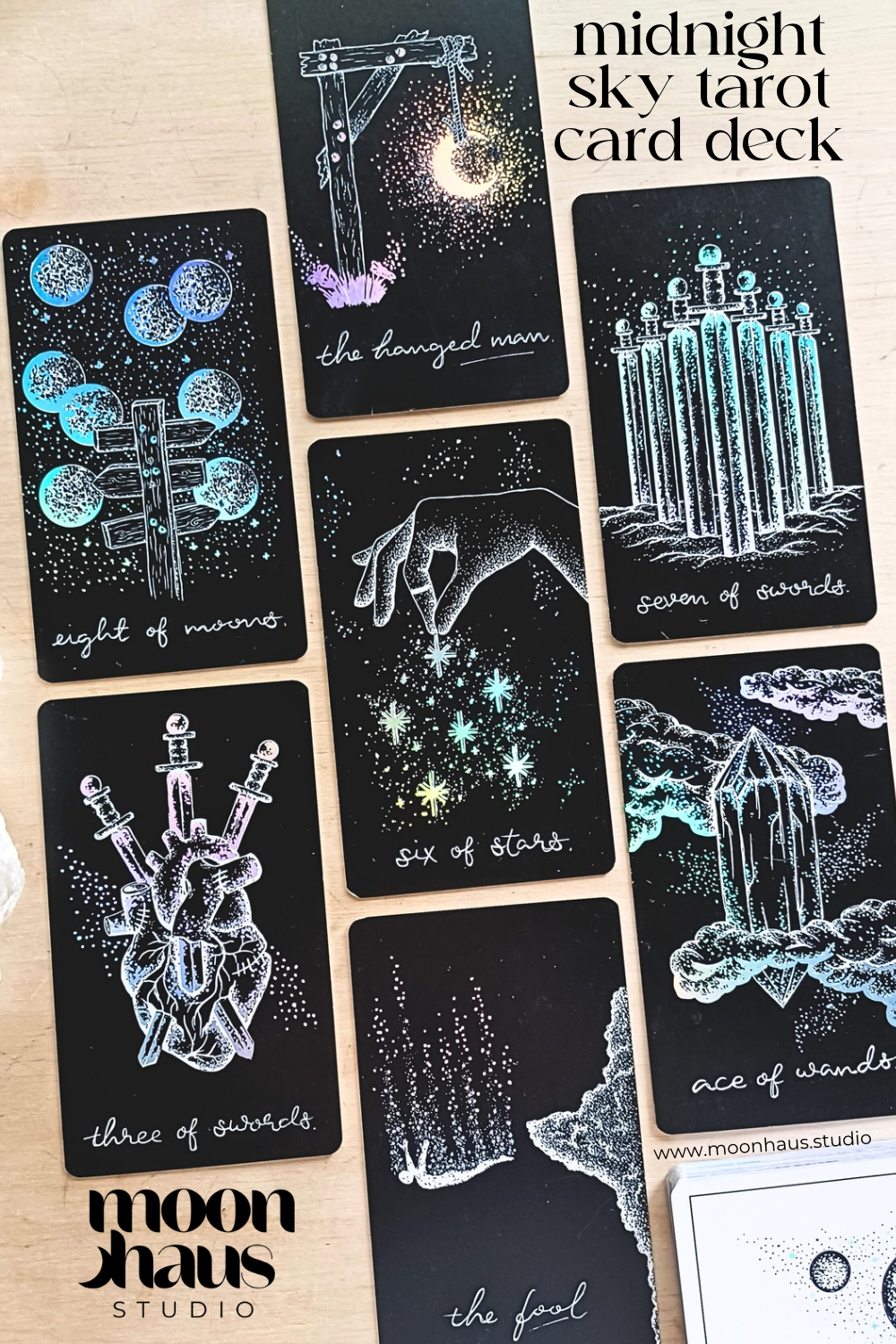 tarot cards, aesthetic: black tarot card art with holographic details & guidebook