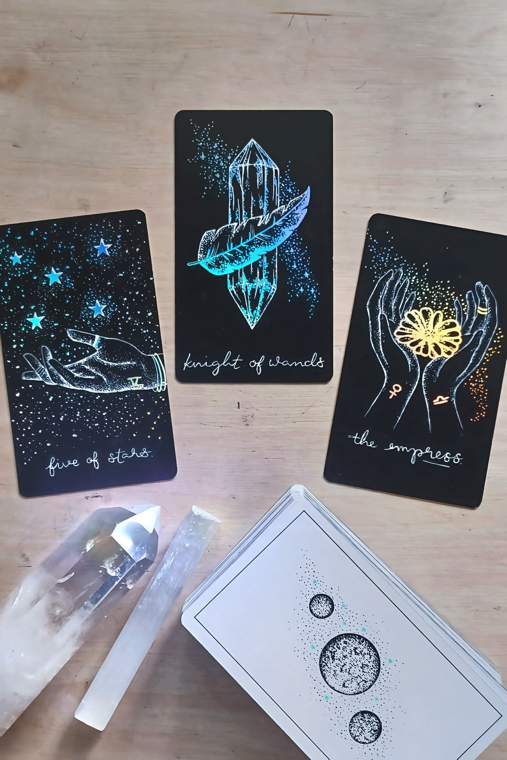 tarot cards, aesthetic: black tarot card art with holographic details & guidebook