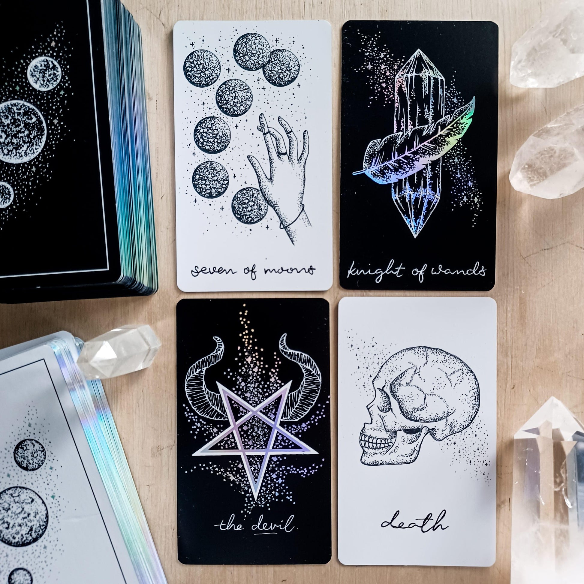 shows cards from Wandering Moon Tarot & inverted cards from its special edition indie counterpart