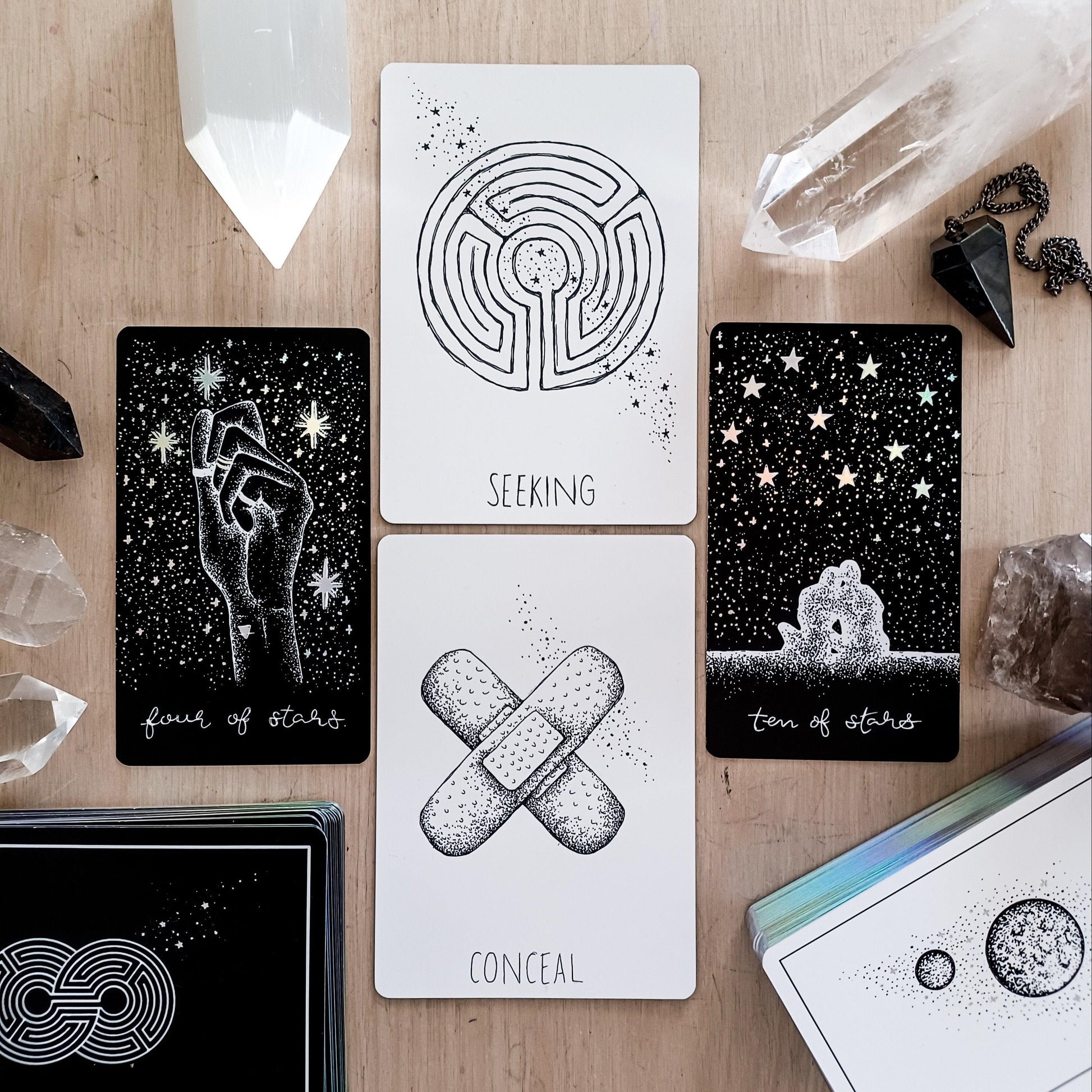 oracle cards from Wandering Soul Oracle paired with Midnight Sky tarot cards, black & white 