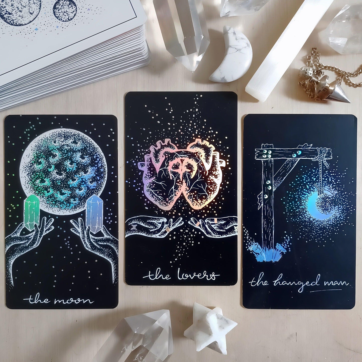 the hanged man, the lovers, the moon: three tarot cards from Midnight Sky indie deck