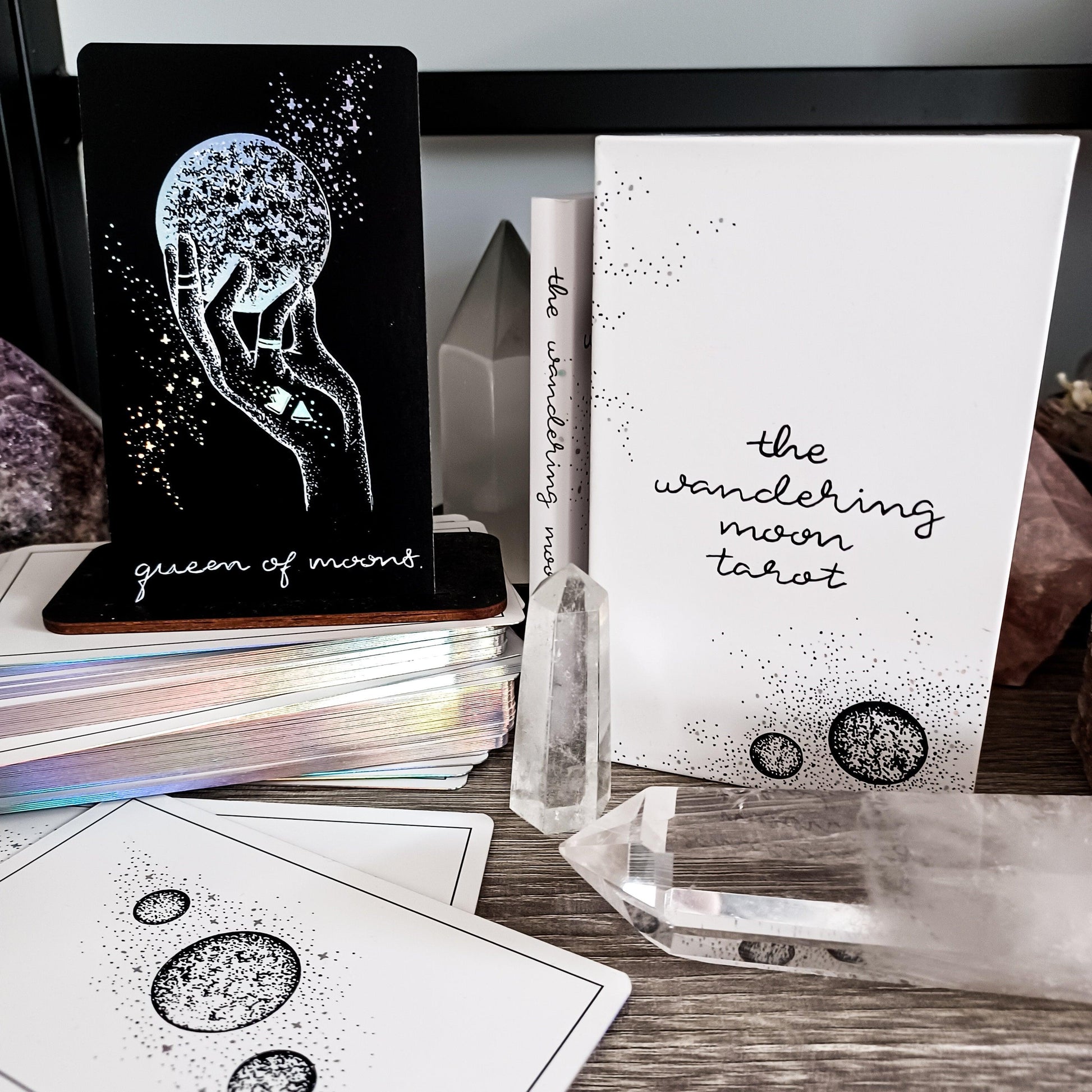 white box and card backs with Queen of Cups card from this tarot deck by The Wandering Moon Co.